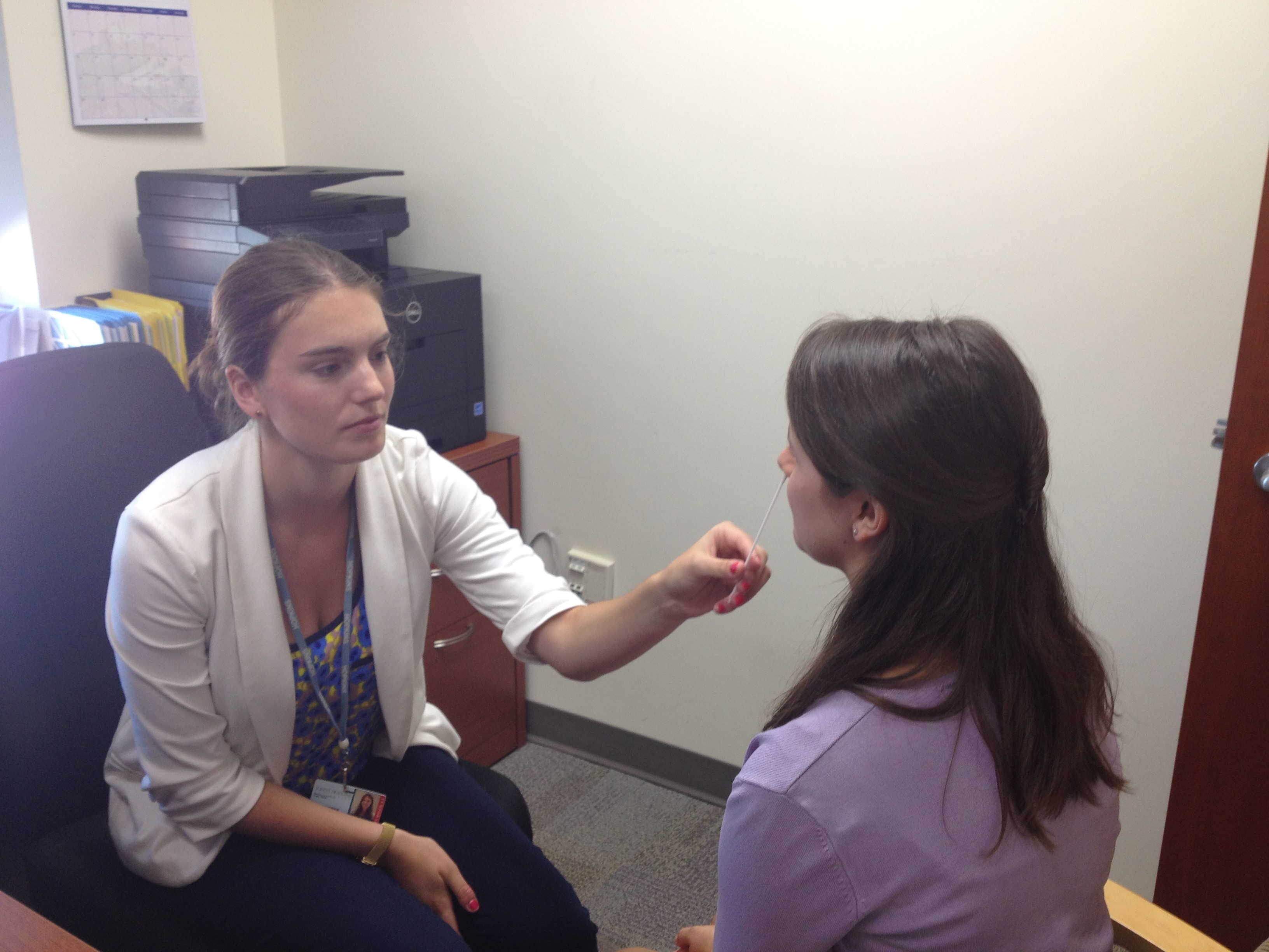 Practicing nasal swabs with Laura, a fellow research assistant